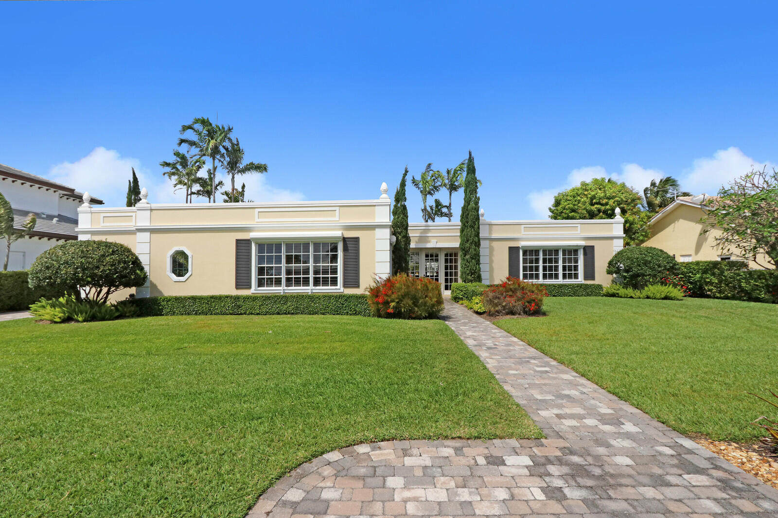 1210 Bimini Lane Singer Island, FL 33404 - Photo 1 of 64 a front view of a house with a yard