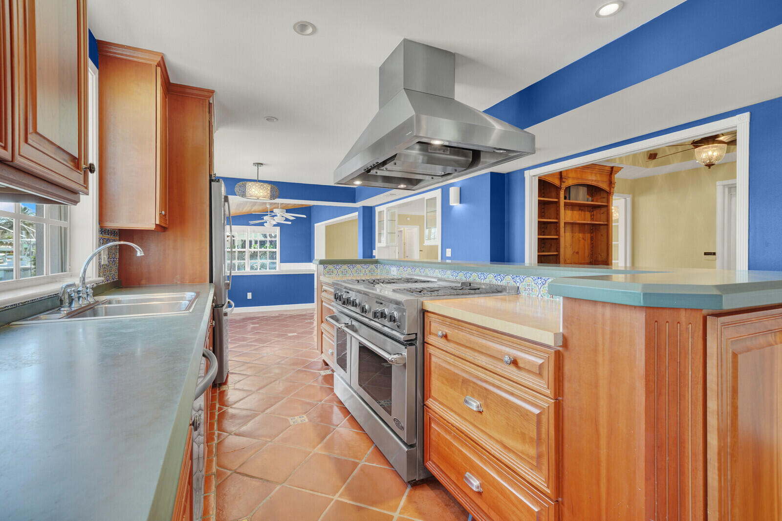 1210 Bimini Lane Singer Island, FL 33404 - Photo 26 of 64 a kitchen with stainless steel appliances granite countertop a stove and a sink
