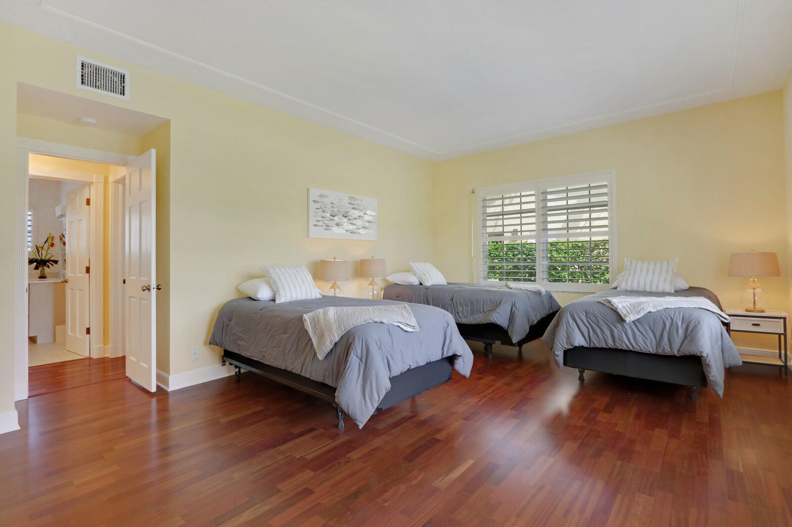1210 Bimini Lane Singer Island, FL 33404 - Photo 37 of 64 a bedroom with double bed and a wooden floor