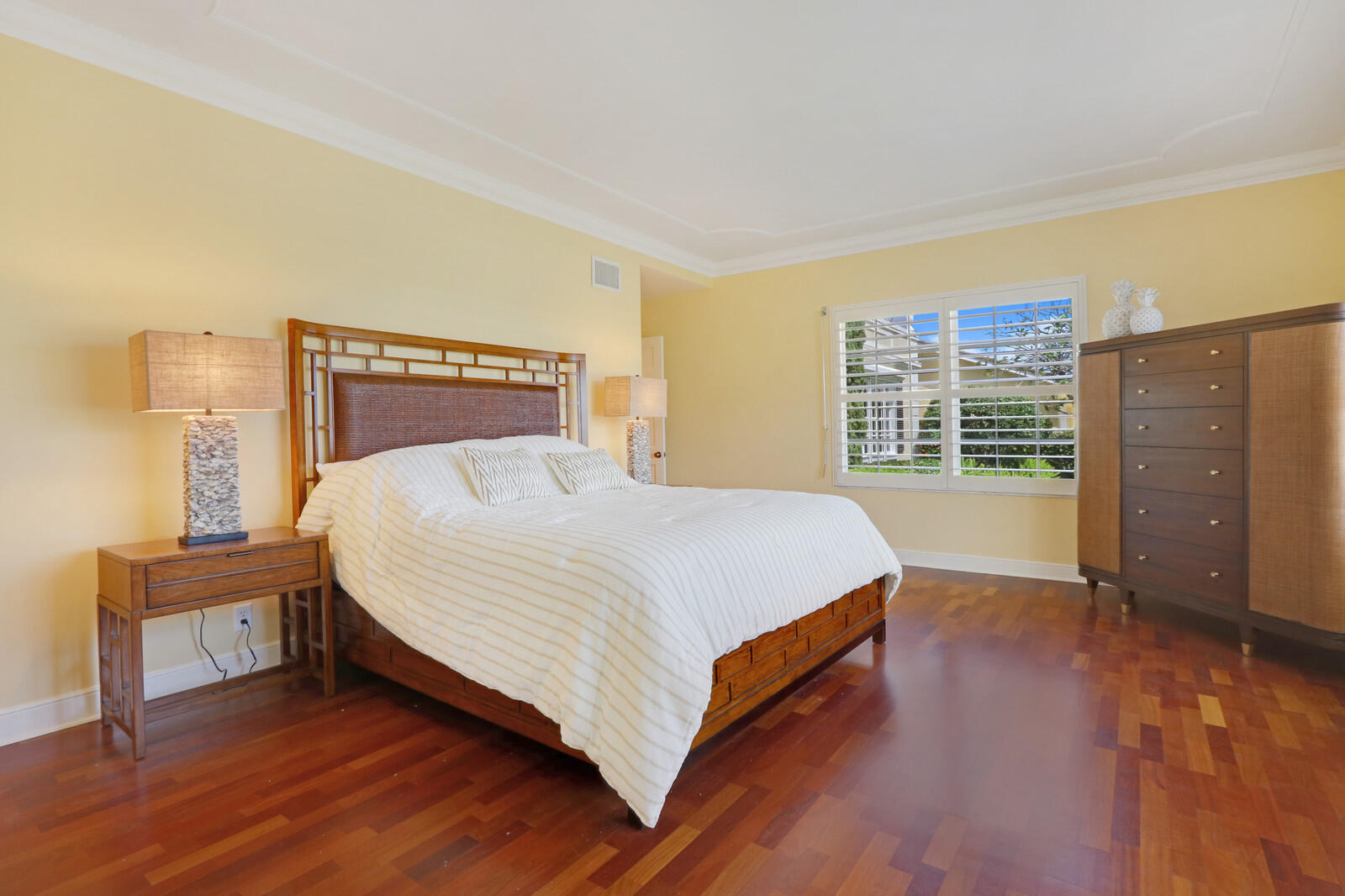 1210 Bimini Lane Singer Island, FL 33404 - Photo 40 of 64 a bed sitting in a spacious bedroom next to a window