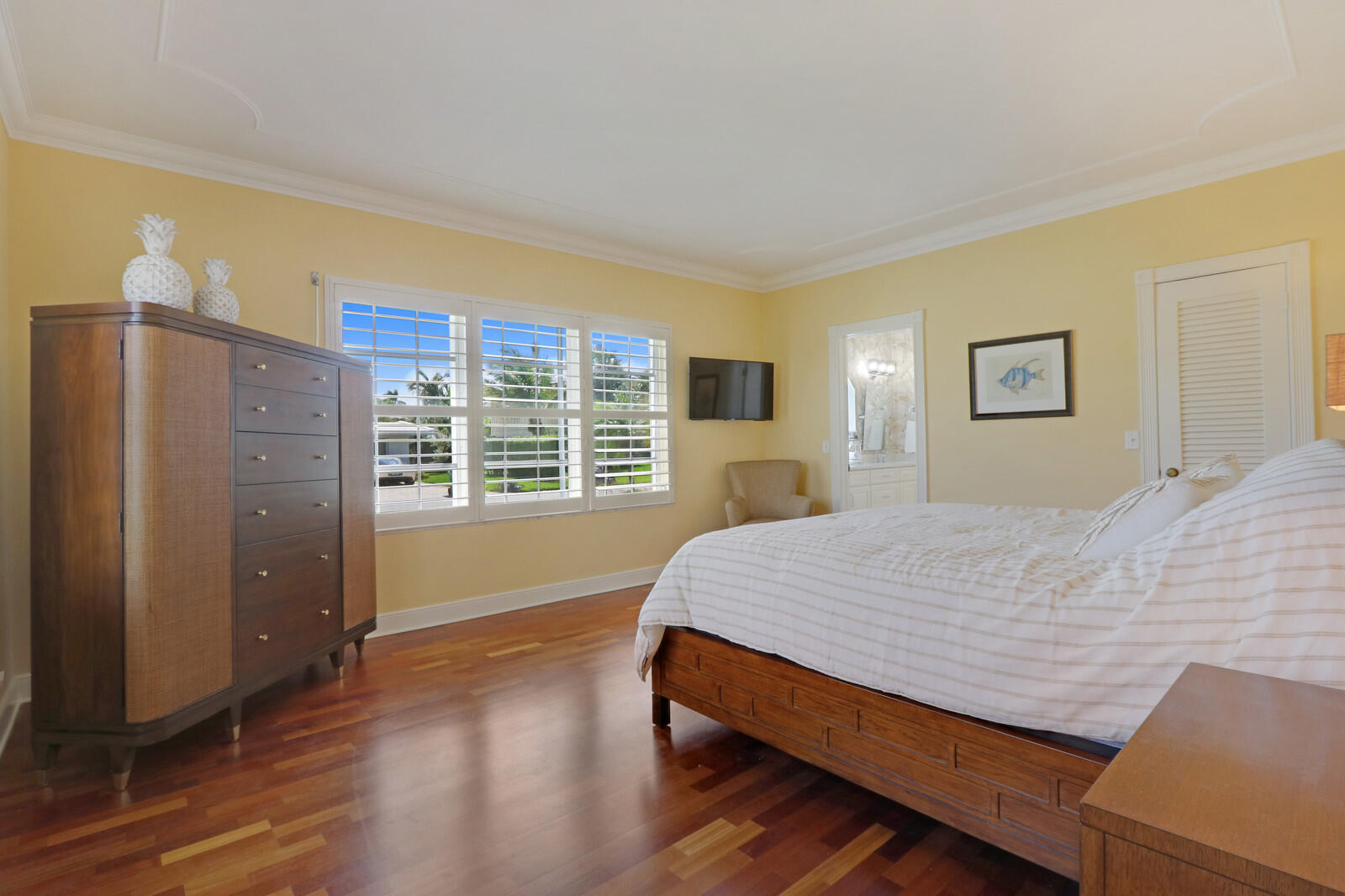 1210 Bimini Lane Singer Island, FL 33404 - Photo 42 of 64 a bed sitting in a spacious bedroom next to a window
