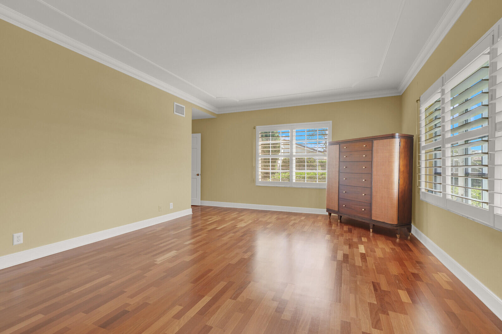 1210 Bimini Lane Singer Island, FL 33404 - Photo 44 of 64 an empty room with wooden floor and windows