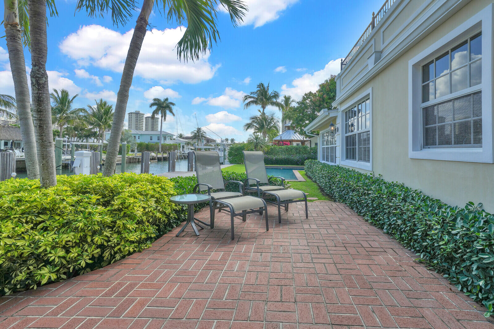 1210 Bimini Lane Singer Island, FL 33404 - Photo 50 of 64 a view of a patio with a table and chairs and potted plants