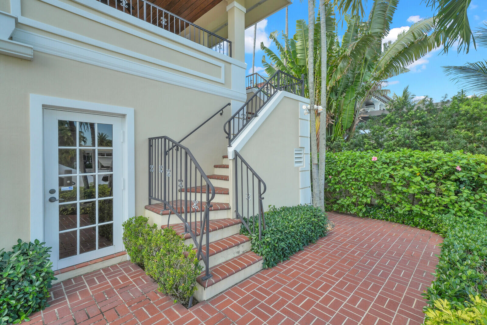 1210 Bimini Lane Singer Island, FL 33404 - Photo 55 of 64 a view of a house with a small yard and plants