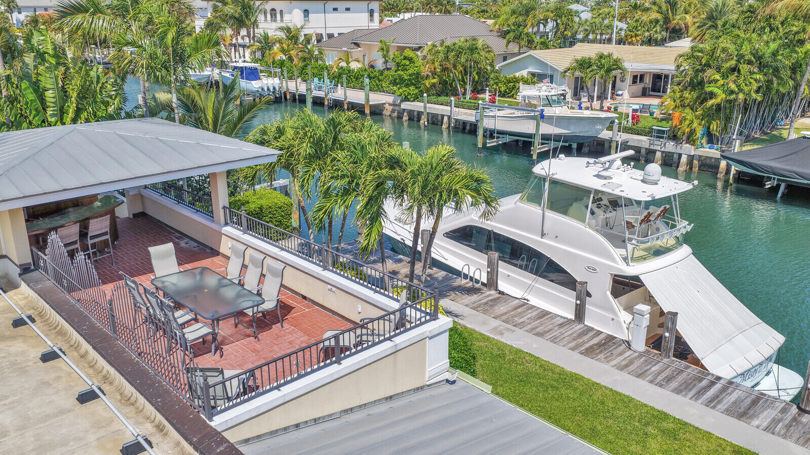 1210 Bimini Lane Singer Island, FL 33404 - Photo 58 of 64 a view of a house with pool and chairs