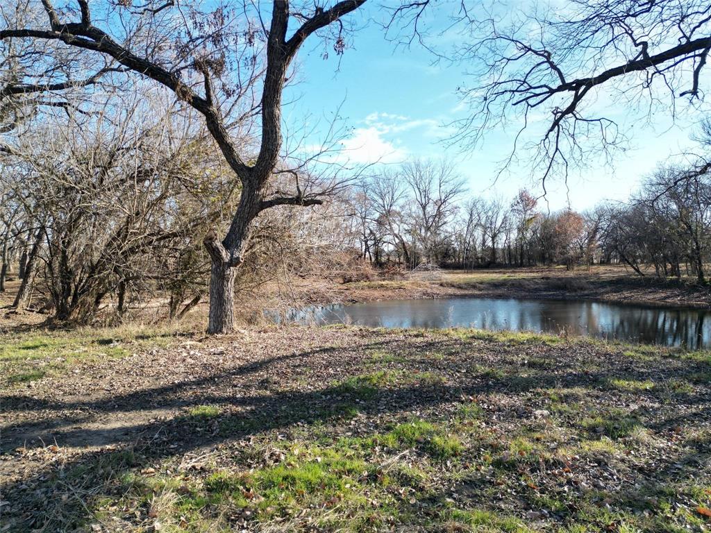 Lot 5-tbd Lot 5-tbd Hidden Valley Rd Valley View Valley View, TX 76272 - Photo 13 of 25 a view of a lake with a yard
