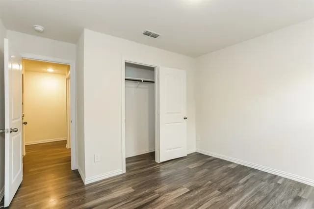 a view of wooden floor in an empty room