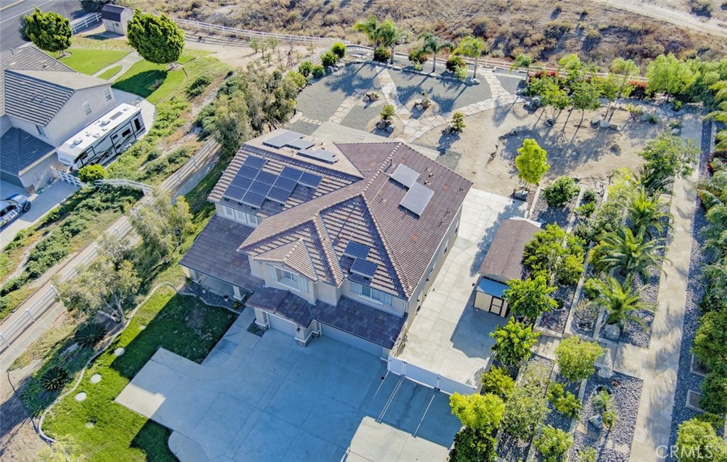 17465 Fairbreeze Court Riverside, CA 92504 - Photo 4 of 30 an aerial view of a house with a yard and garden