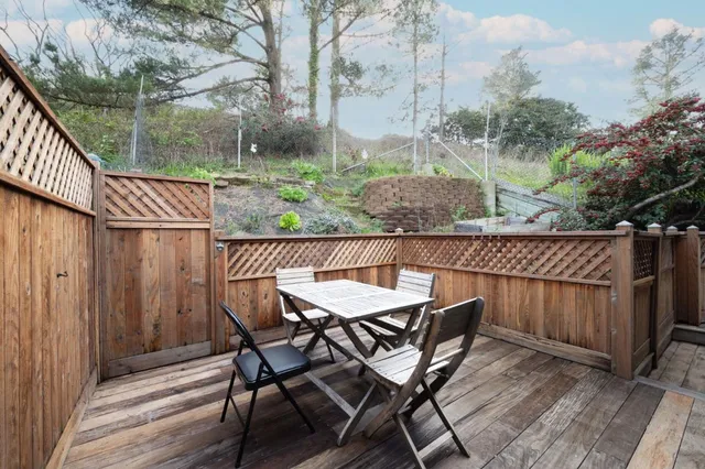 a view of a chairs and table on the wooden floor