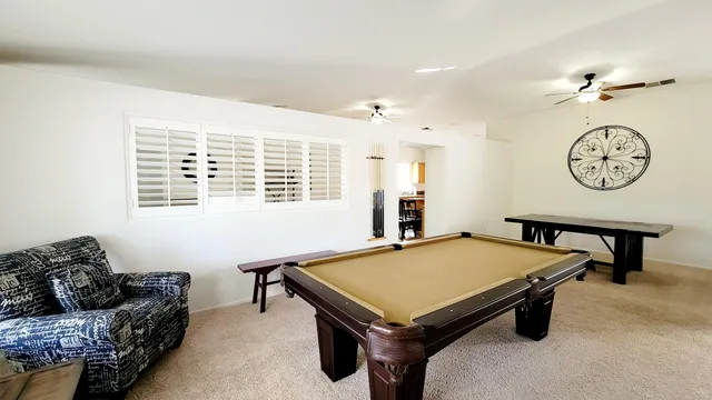 a living room with furniture and a table