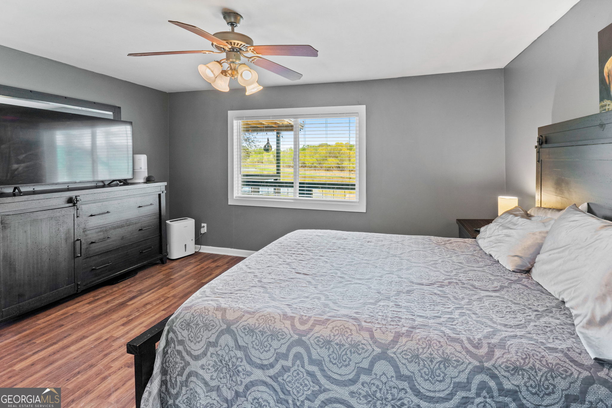 532 Henry Higgins Road Jackson, GA 30233 - Photo 13 of 46 a bedroom with a bed and a flat screen tv