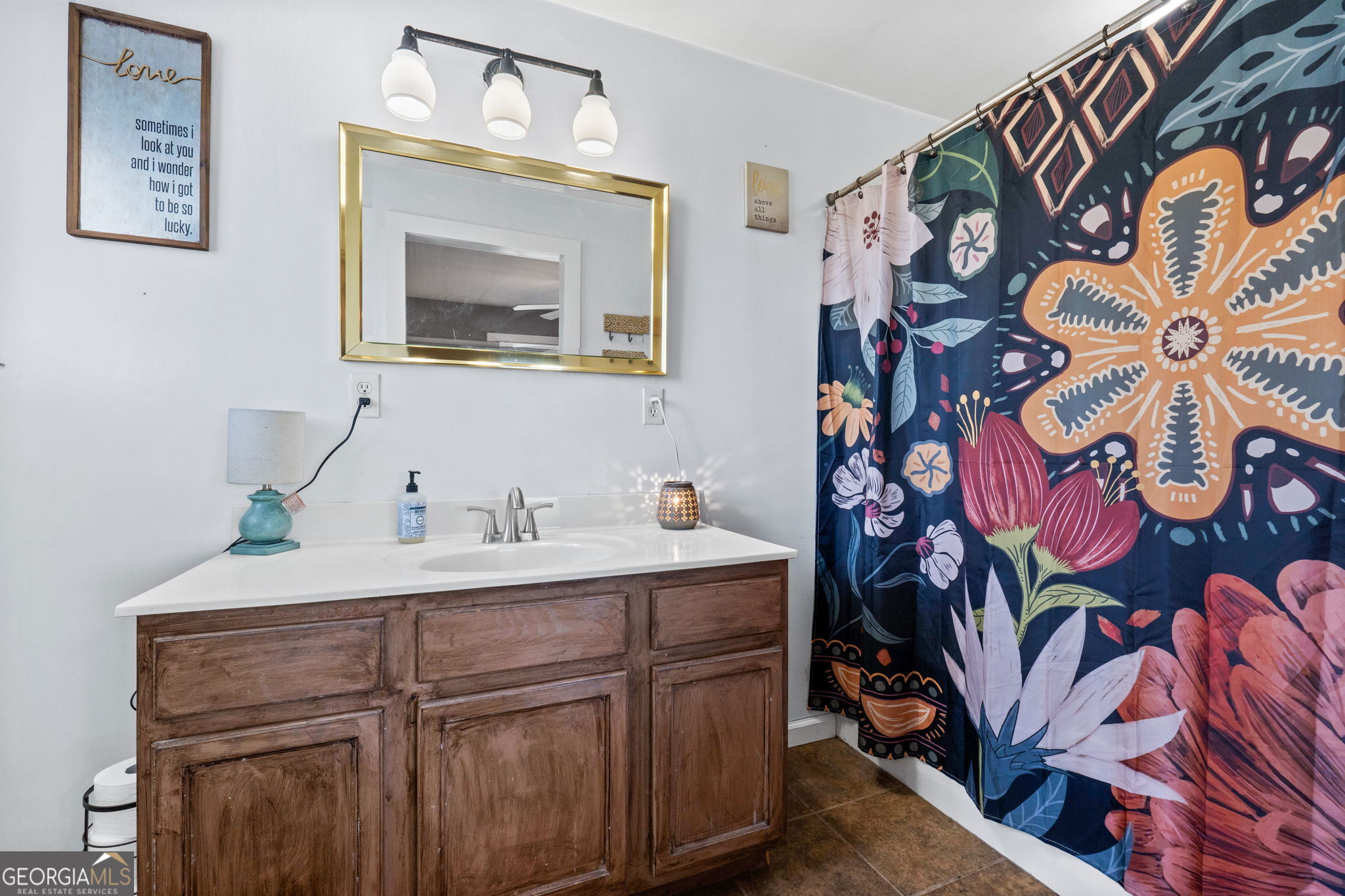 532 Henry Higgins Road Jackson, GA 30233 - Photo 14 of 46 a bathroom with a sink and a mirror
