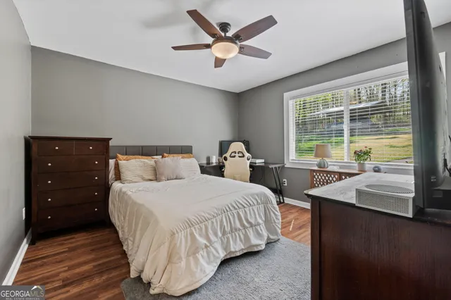 a bedroom with a bed and window