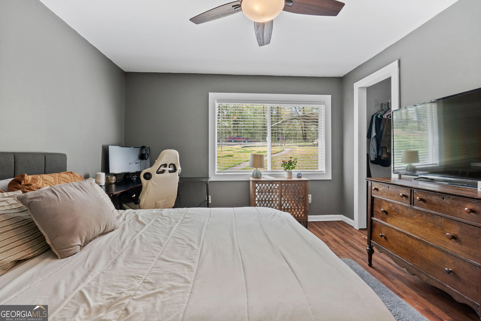 532 Henry Higgins Road Jackson, GA 30233 - Photo 16 of 46 a bedroom with a large bed and a flat tv screen on dresser