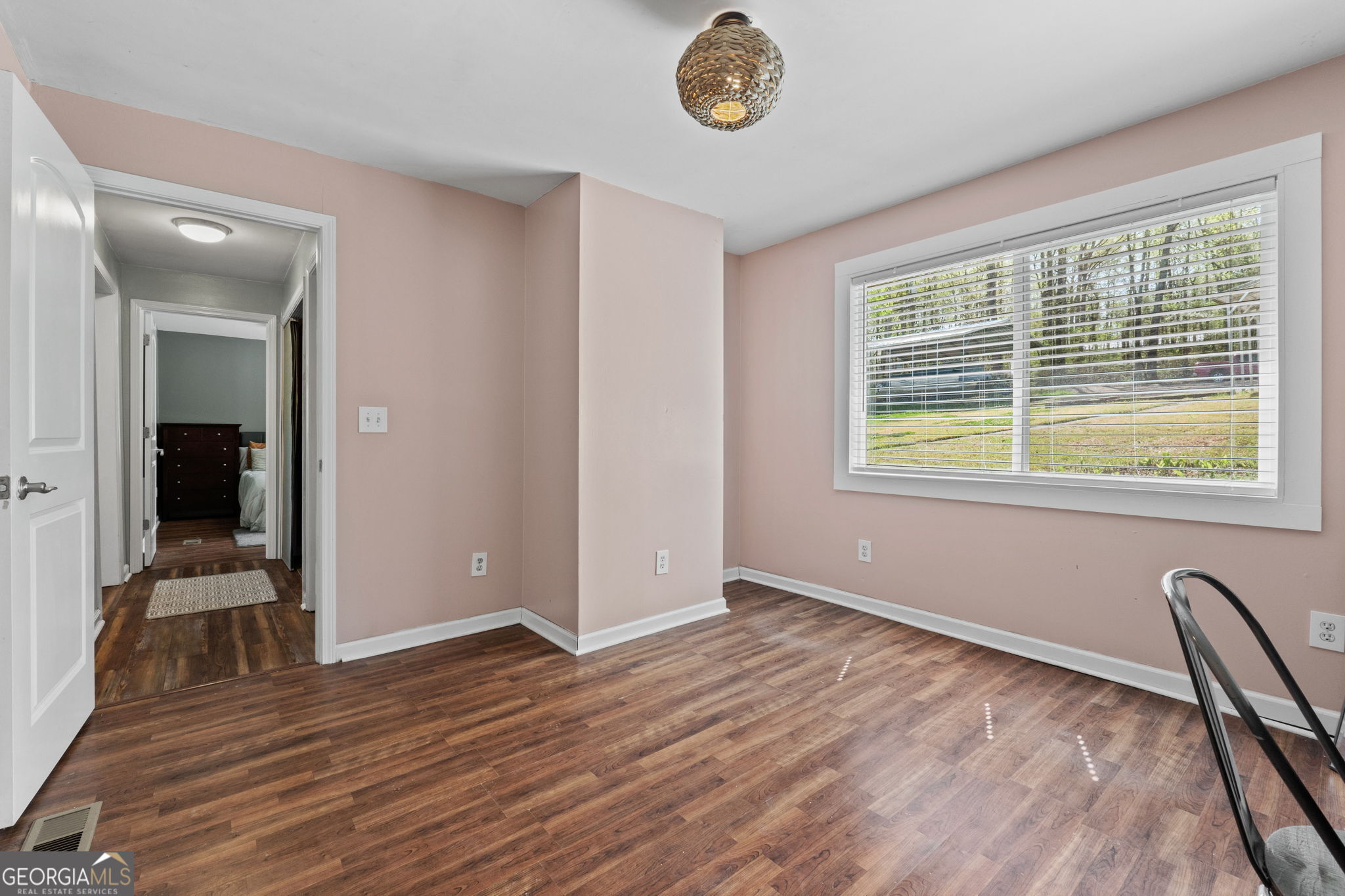 532 Henry Higgins Road Jackson, GA 30233 - Photo 20 of 46 wooden floor in an empty room with a window