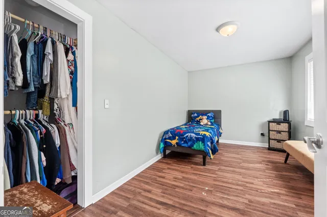 a view of a livingroom with furniture and closet