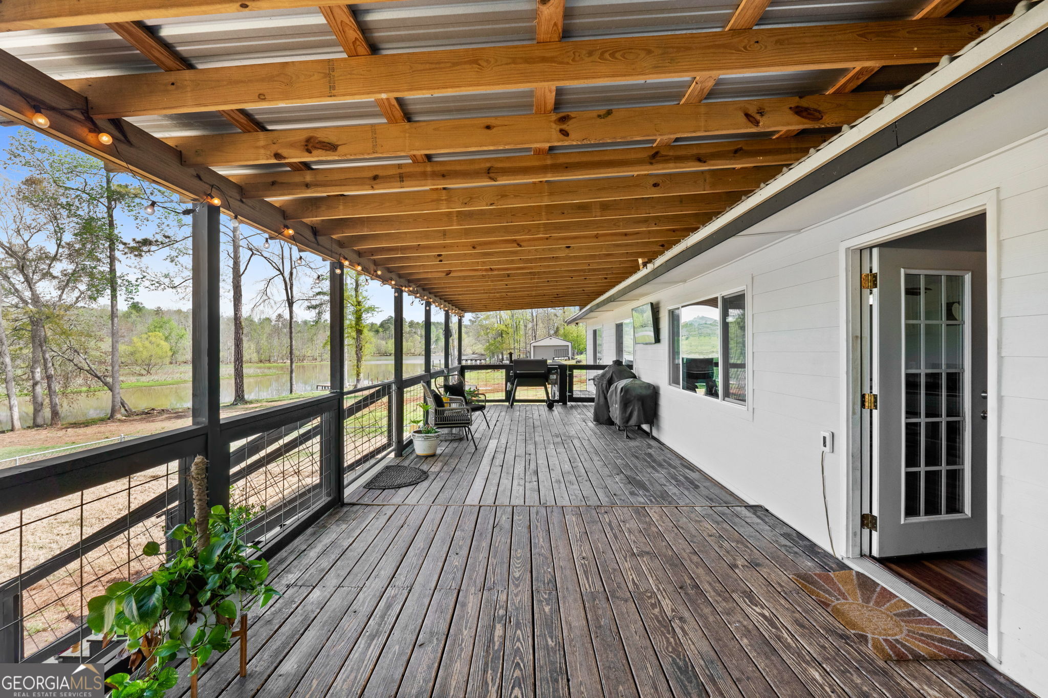532 Henry Higgins Road Jackson, GA 30233 - Photo 24 of 46 a view of living room with wooden floor and balcony