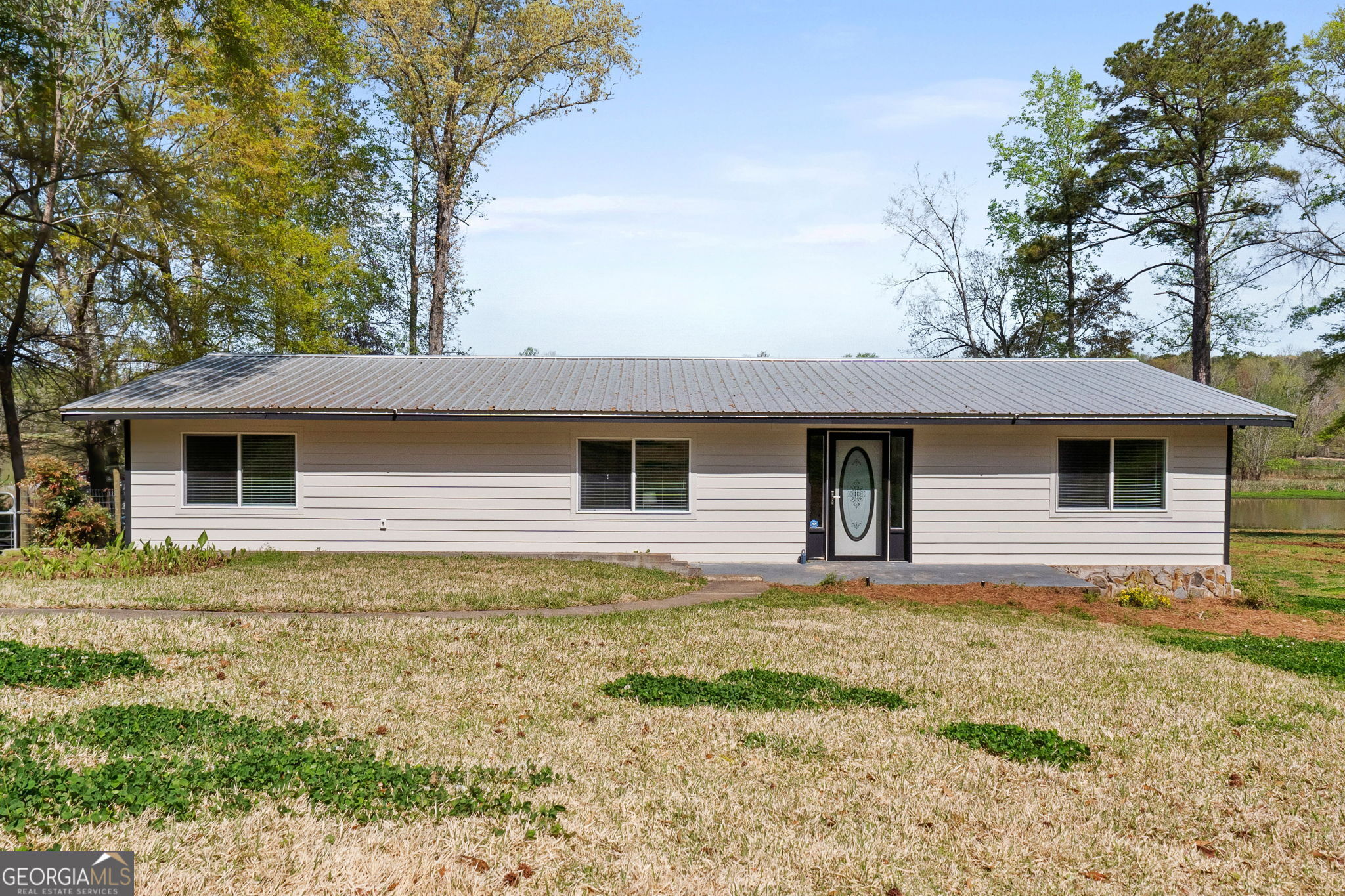 532 Henry Higgins Road Jackson, GA 30233 - Photo 41 of 46 a front view of house with yard and trees