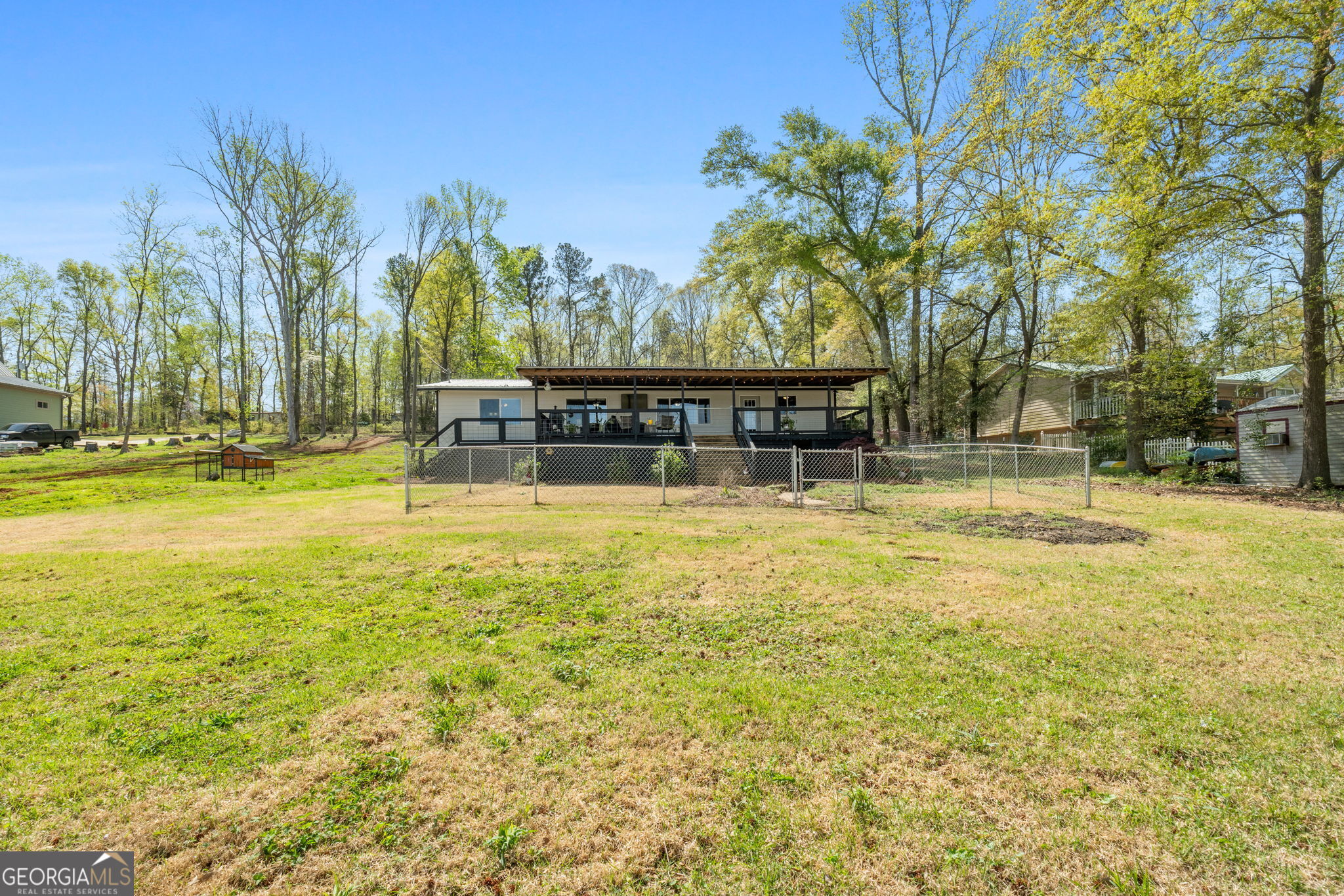 532 Henry Higgins Road Jackson, GA 30233 - Photo 43 of 46 a swimming pool with outdoor seating and yard