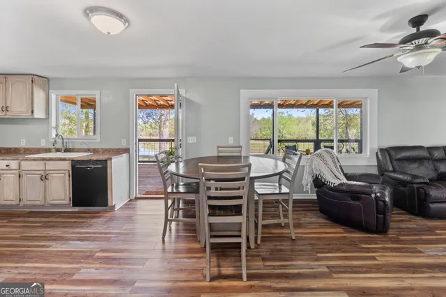 a view of a dining room with furniture window and wooden floor