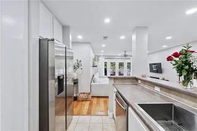 a kitchen with a sink and refrigerator