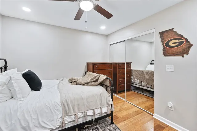 a bedroom with a bed and a lamp