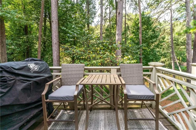 a view of a chairs and table on the deck