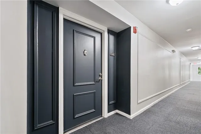 a view of hallway with cabinets