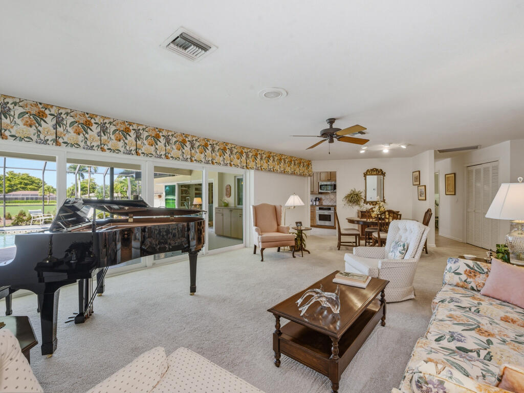 314 Torrey Pines Point Naples, FL 34113 - Photo 2 of 21 a living room with furniture and a large window