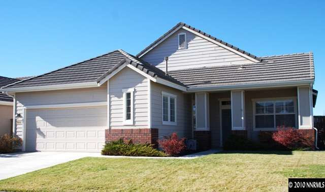 10201 Wolf Ridge Way Reno, NV 89521 - Photo 1 of 11 a front view of a house with garden