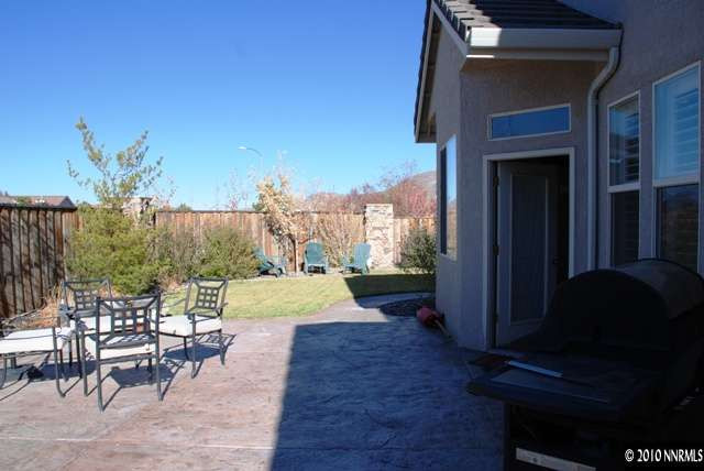 10201 Wolf Ridge Way Reno, NV 89521 - Photo 11 of 11 a view of a porch with furniture and a yard