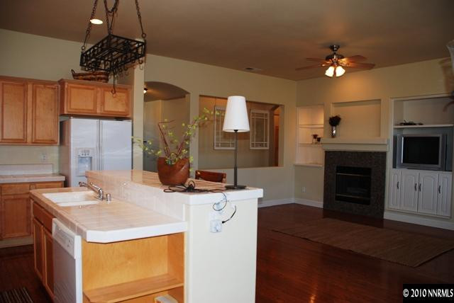 10201 Wolf Ridge Way Reno, NV 89521 - Photo 5 of 11 a kitchen with a sink stove and refrigerator