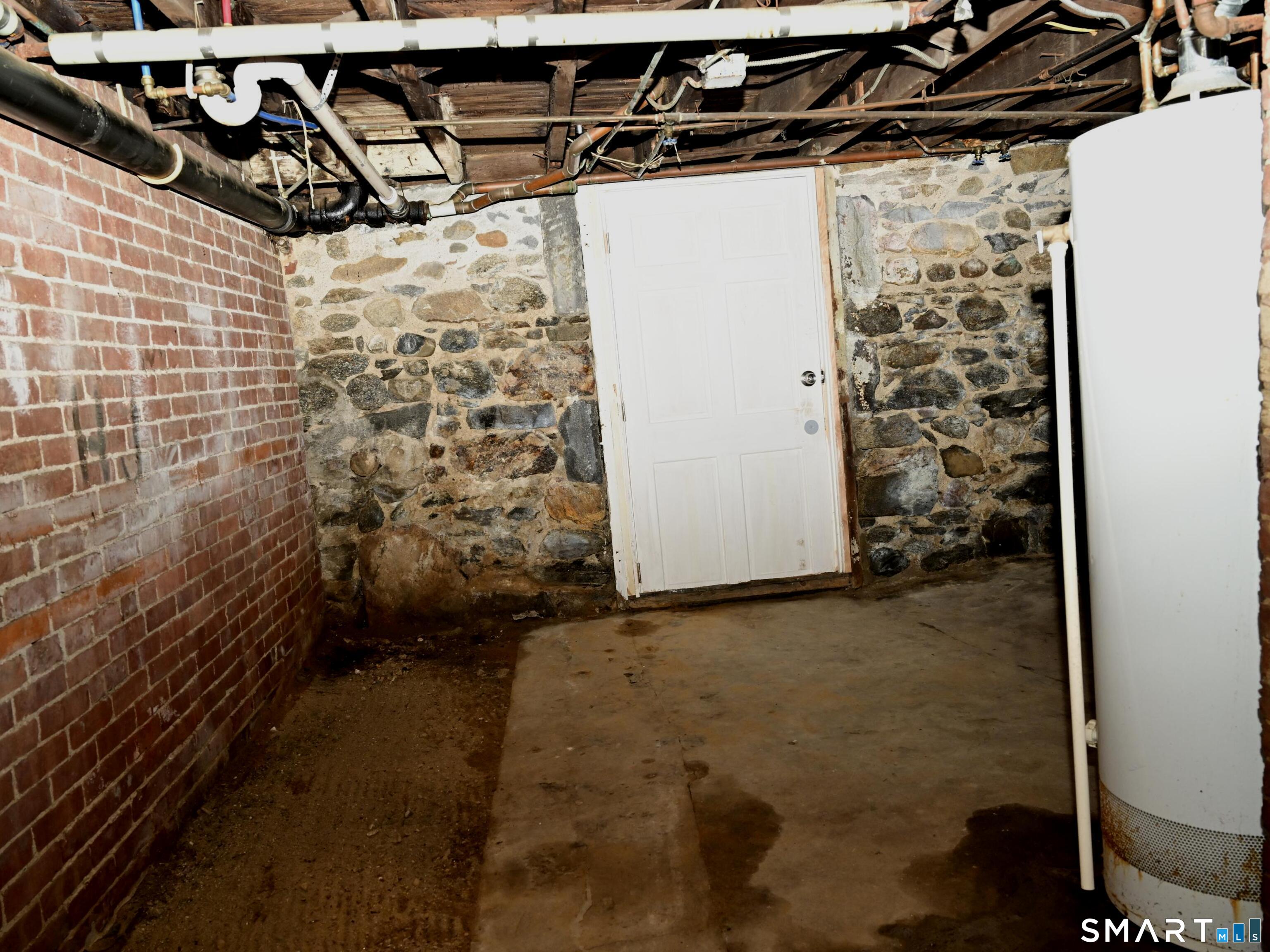 29 Locke Street Ansonia, CT 06401 - Photo 20 of 39 Right side unit basement exit door to back yard Bilco doors