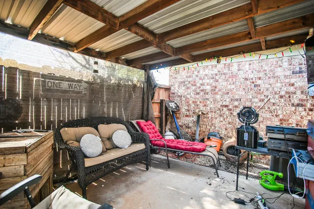 a backyard of a house with outdoor seating