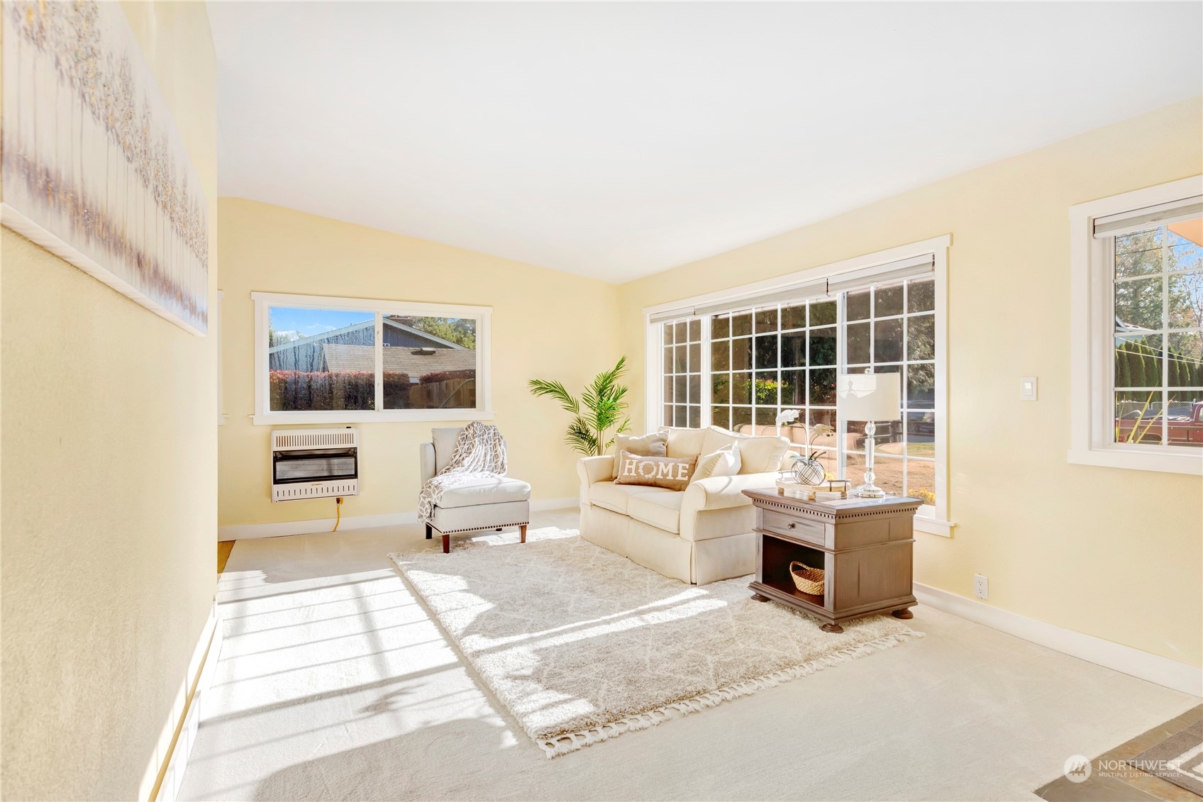 11404 Southeast 169th Street Renton, WA 98055 - Photo 6 of 25 a living room with furniture large windows and view