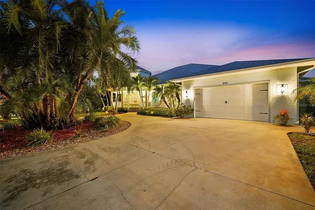 a bathroom with a granite countertop toilet a sink and a mirror