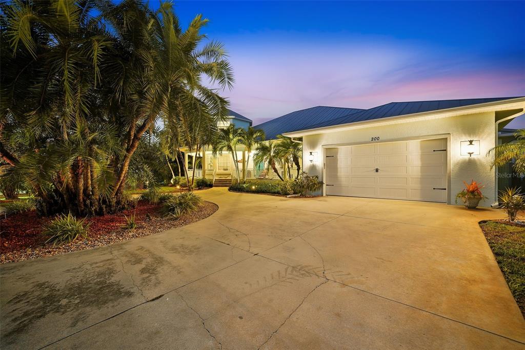 200 Capstan Drive Placida, FL 33946 - Photo 25 of 86 a view of a building with a yard