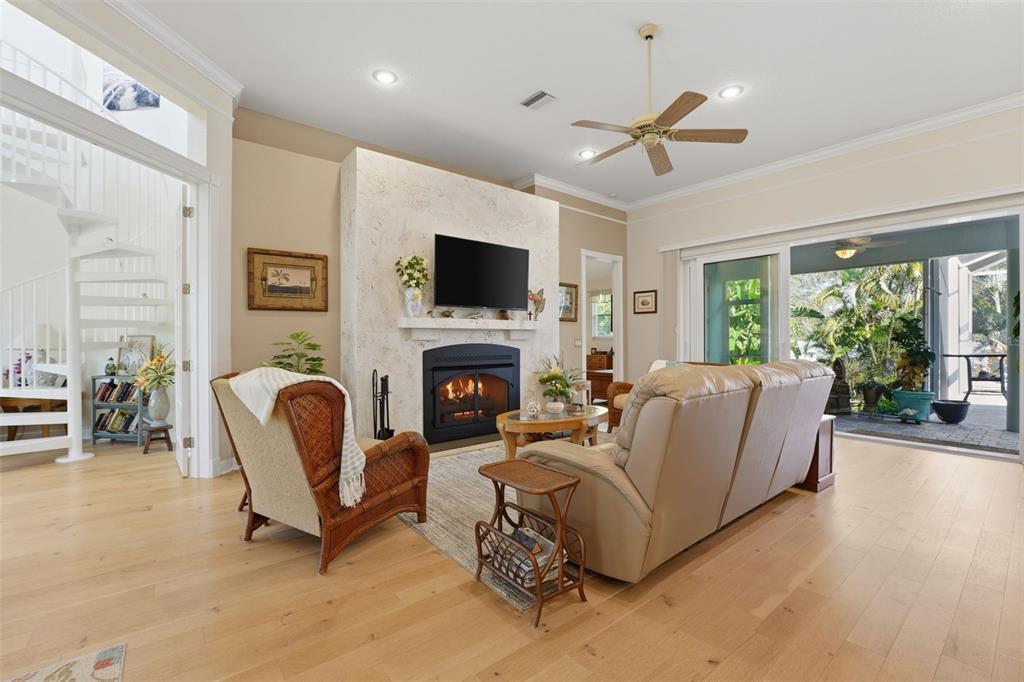 200 Capstan Drive Placida, FL 33946 - Photo 4 of 86 a living room with furniture a fireplace and a flat screen tv