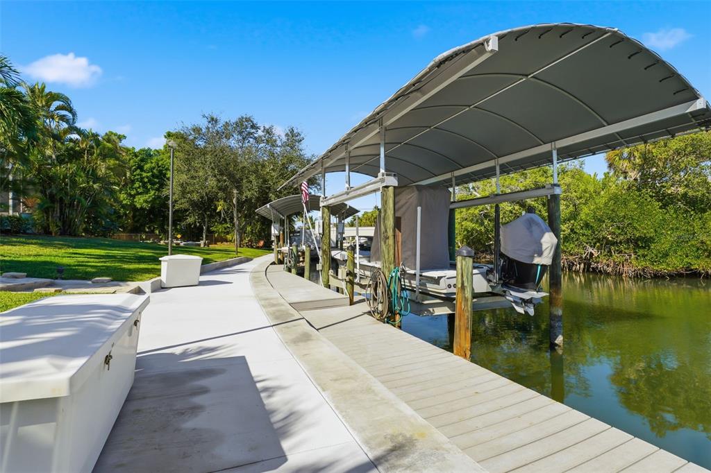 200 Capstan Drive Placida, FL 33946 - Photo 41 of 86 a view of a patio with a table and chairs under an umbrella