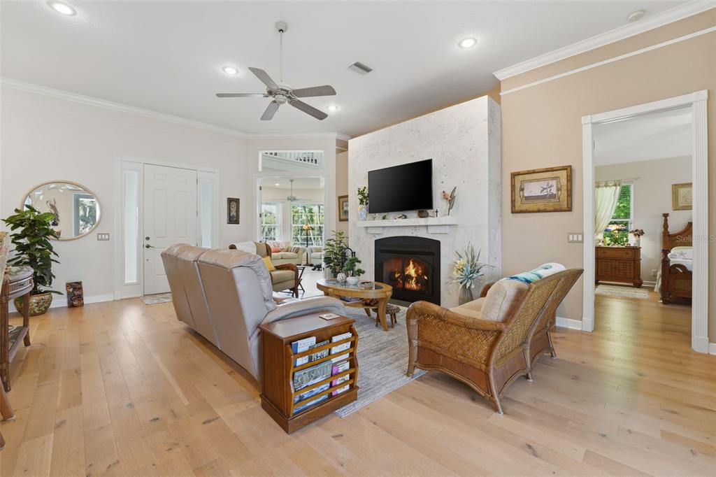 200 Capstan Drive Placida, FL 33946 - Photo 6 of 86 a living room with furniture a fireplace and a flat screen tv