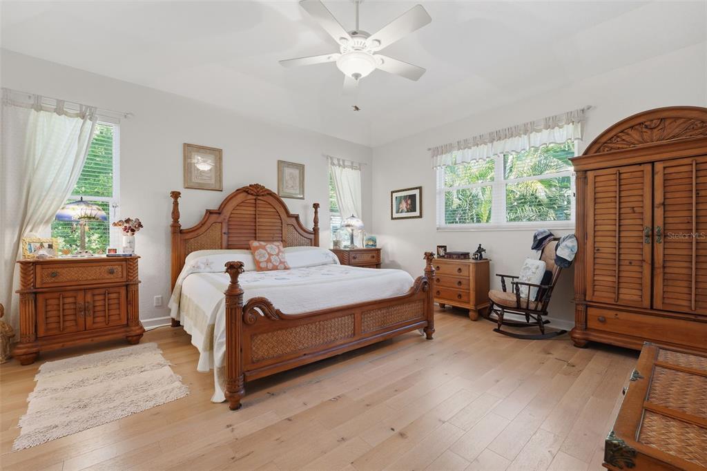 200 Capstan Drive Placida, FL 33946 - Photo 64 of 86 a bed room with a bed and a chandelier