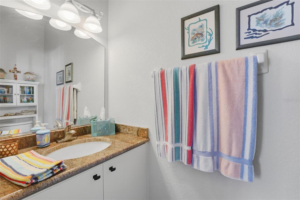 200 Capstan Drive Placida, FL 33946 - Photo 68 of 86 a bathroom with a sink vanity and a mirror
