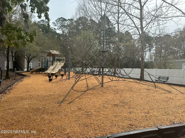 a view of a yard with a slide