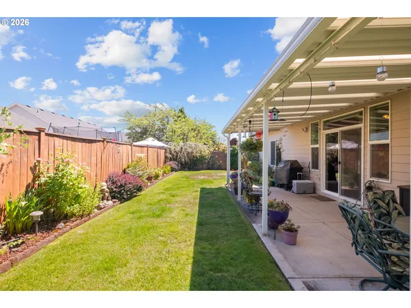 a view of backyard with patio