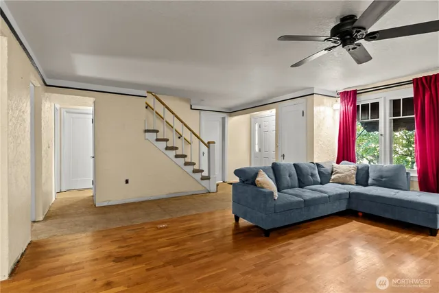 a living room with furniture and a large window