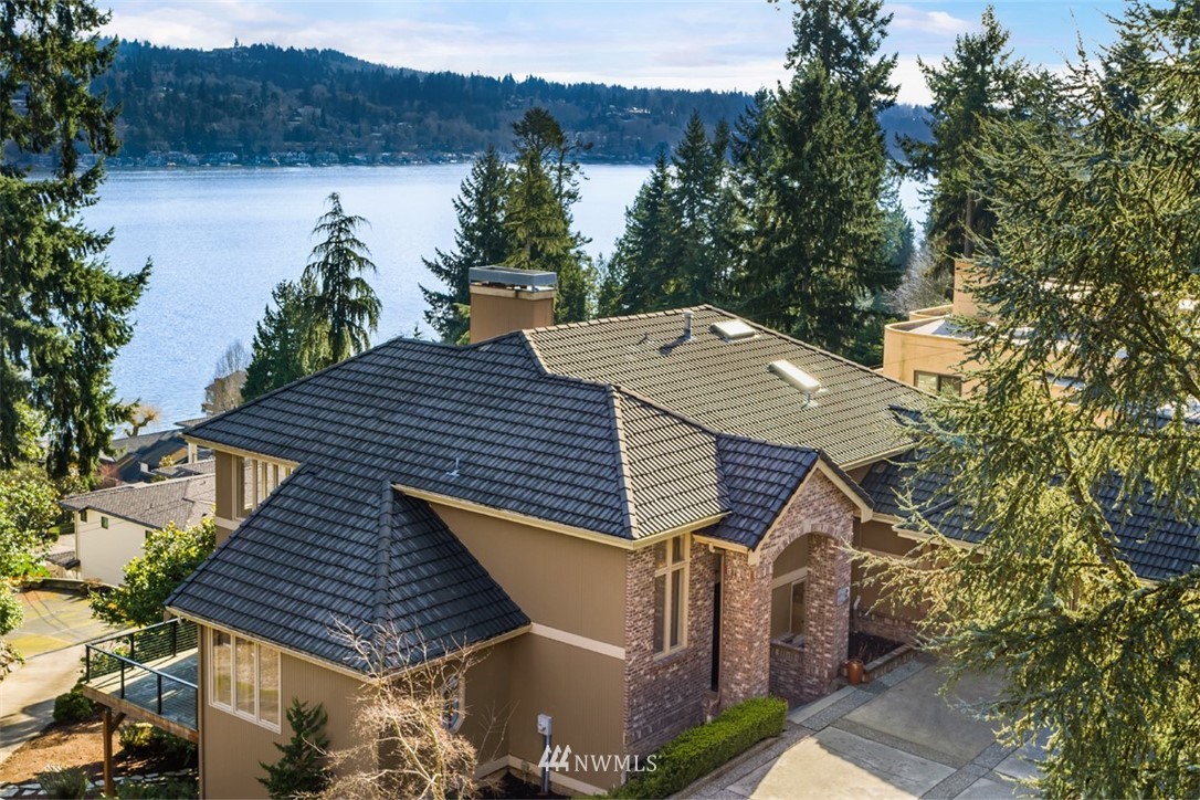 a view of a house with pool and a garden