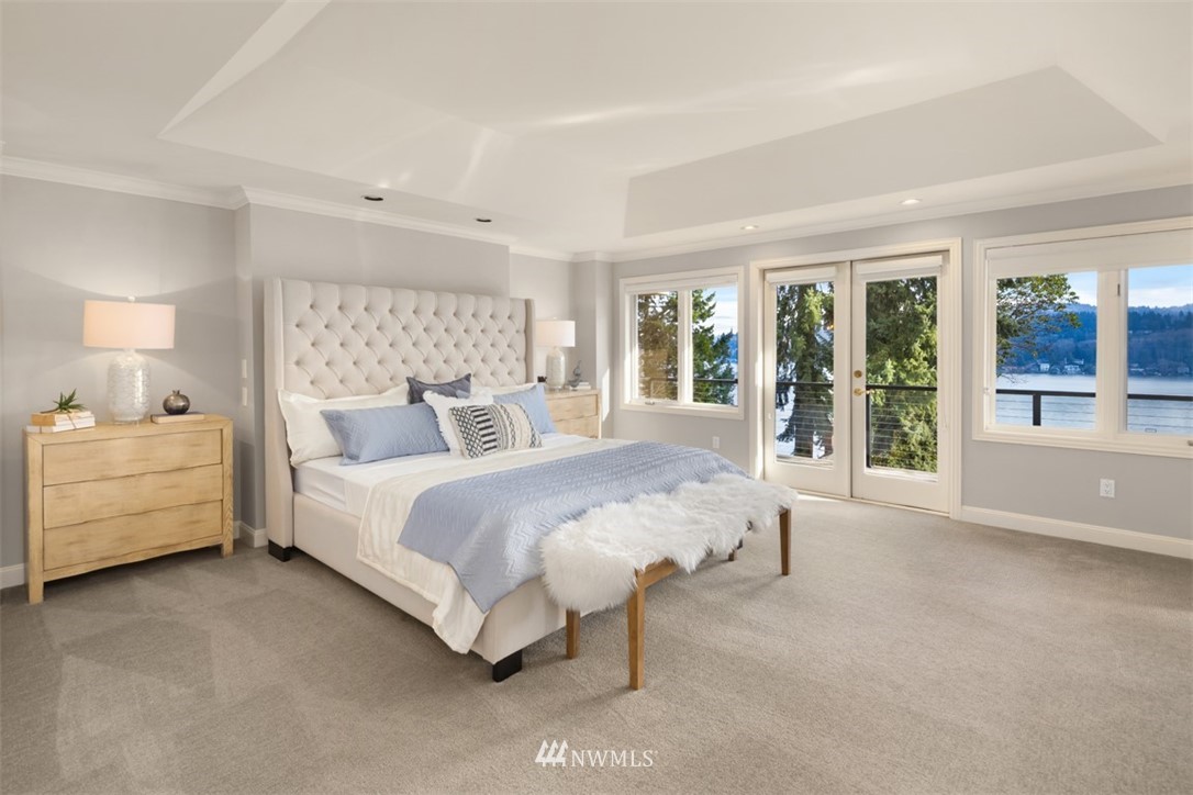 5648 East Mercer Way Mercer Island, WA 98040 - Photo 16 of 26 a spacious bedroom with a bed and a large window