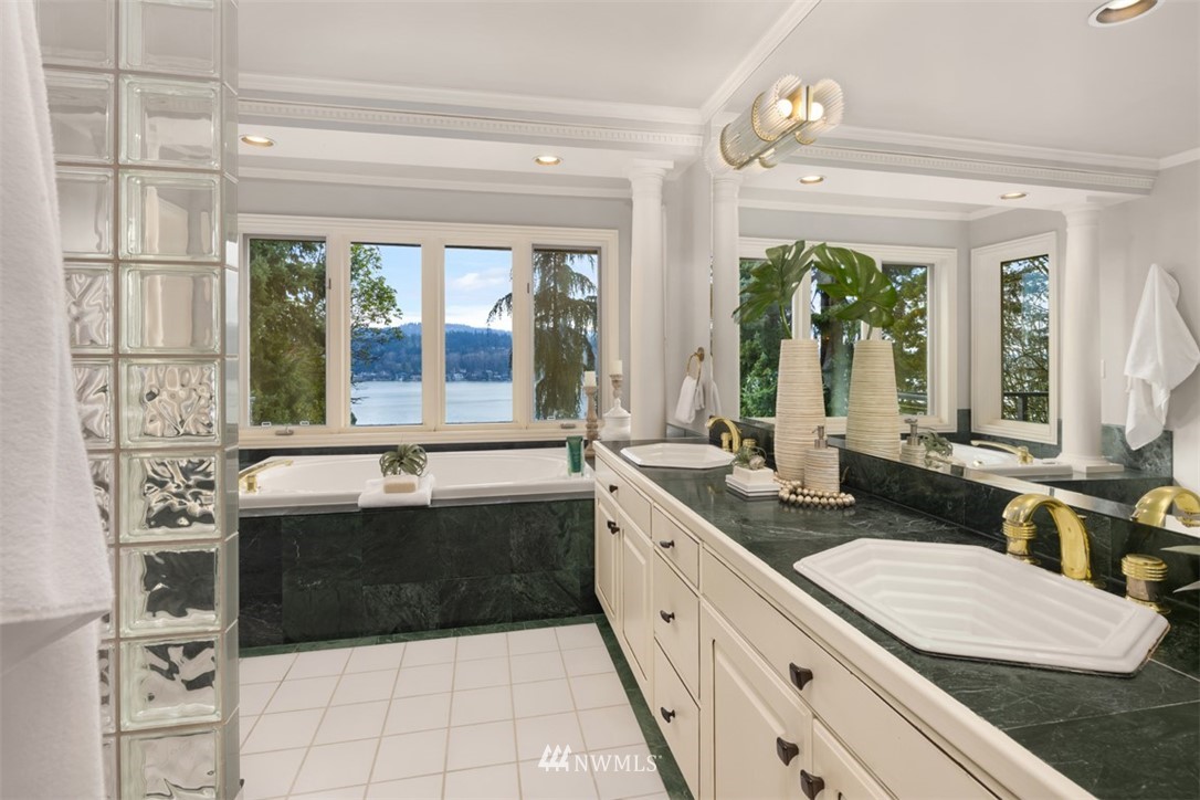 5648 East Mercer Way Mercer Island, WA 98040 - Photo 19 of 26 a bathroom with a granite countertop tub sink and large window