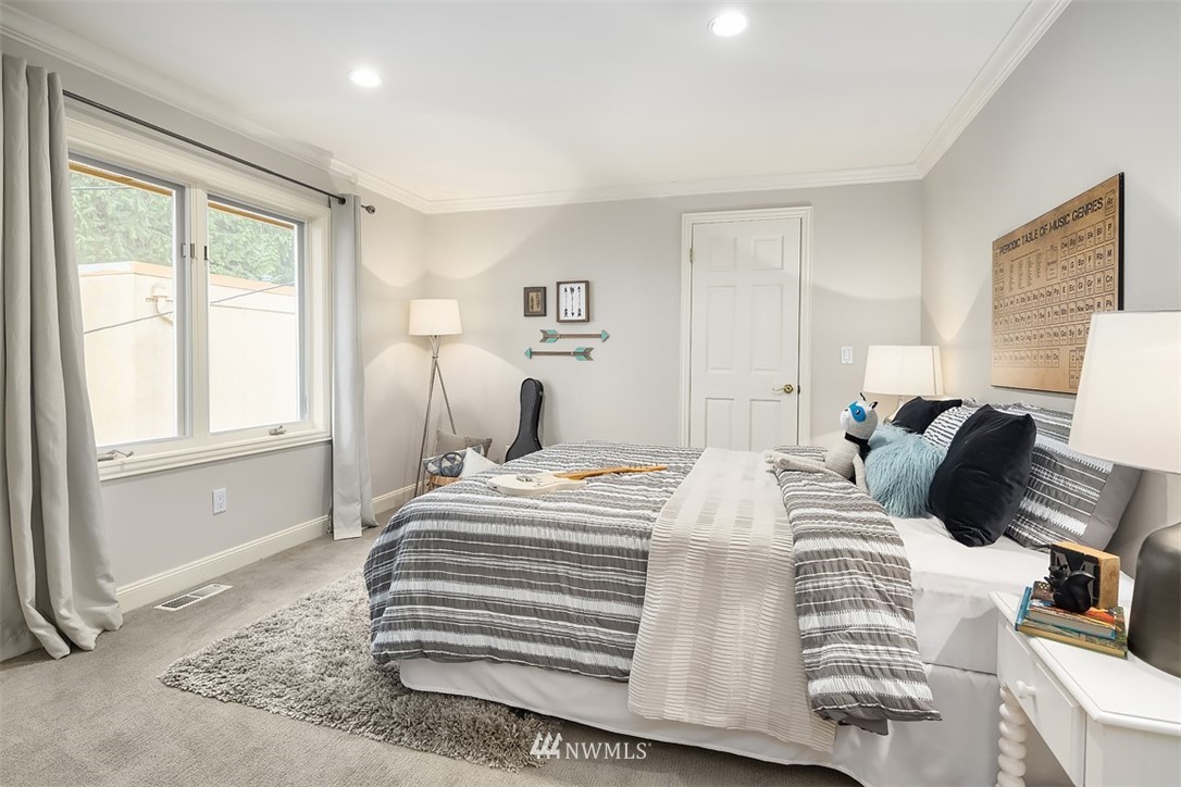 5648 East Mercer Way Mercer Island, WA 98040 - Photo 20 of 26 a bedroom with a bed and wooden floor