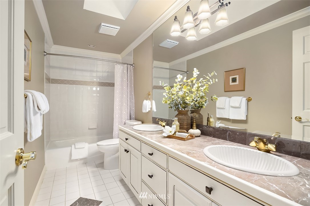 5648 East Mercer Way Mercer Island, WA 98040 - Photo 21 of 26 a bathroom with a double vanity sink mirror and toilet